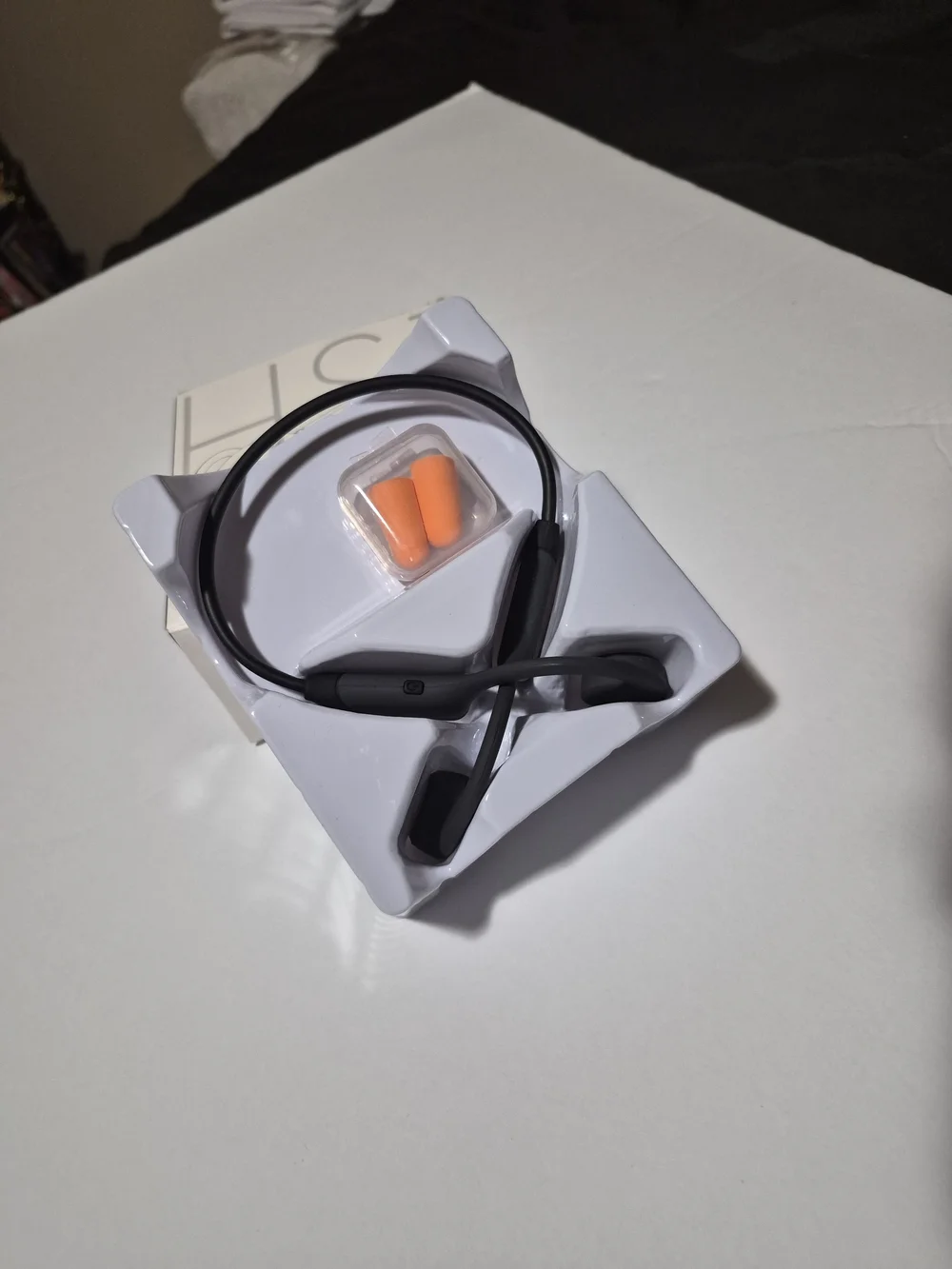 Bone Conduction Headphones in Black with Orange Earplugs